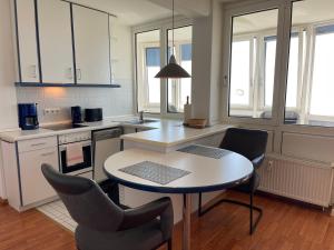O bucătărie sau chicinetă la Apartment 123
