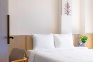 Postel nebo postele na pokoji v ubytování River Park Hotel Dalat