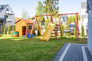 Herní místnost nebo prostor pro děti v ubytování Magnolia pokoje i apartamenty Dębki