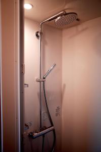 a shower in a bathroom with a shower head at MAGATAMA,INN - Vacation STAY 85473v in Sumoto