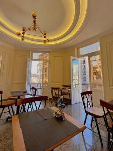 a dining room with tables and chairs and a ceiling at City View Palace hotel in Cairo