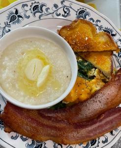 een bord met spek en een kom boter bij Creole Dame Bed & Breakfast Inn in Sumter