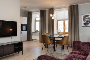 TV a/nebo společenská místnost v ubytování Centra Nams - Center Apartments