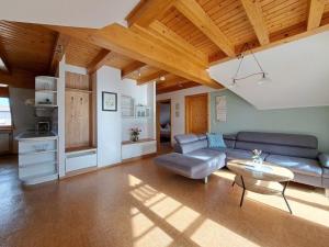a living room with a couch and a table at Ferienwohnung Sauer in Pfofeld