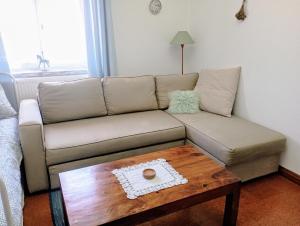 a living room with a couch and a coffee table at Sunset Vista Apartment B in Mação