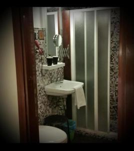 a bathroom with a sink and a toilet at Cà Tron Apartment next to Rialto bridge in Venice