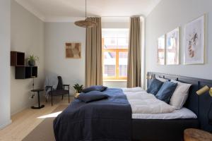Postel nebo postele na pokoji v ubytování Centra Nams - Center Apartments