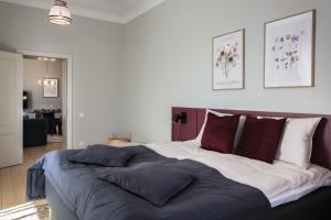Postel nebo postele na pokoji v ubytování Centra Nams - Center Apartments