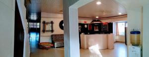 a living room with a kitchen with a counter top at Hotel Blue Valley in Mount Ābu
