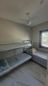 Postelja oz. postelje v sobi nastanitve Casa Arraial do Cabo - Figueira