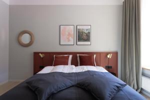 Postel nebo postele na pokoji v ubytování Centra Nams - Center Apartments