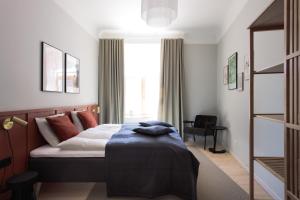 Postel nebo postele na pokoji v ubytování Centra Nams - Center Apartments
