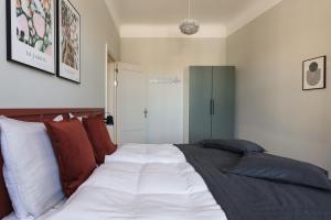 Postel nebo postele na pokoji v ubytování Centra Nams - Center Apartments