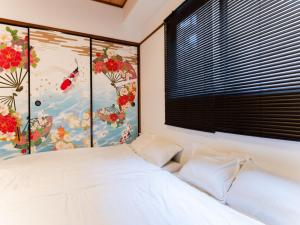 Ένα ή περισσότερα κρεβάτια σε δωμάτιο στο Shinjuku,Ushigome Yanagicho Sta 1min walk , Kabukicho3min