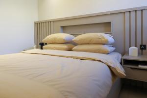 En eller flere senge i et værelse på MUSTQR