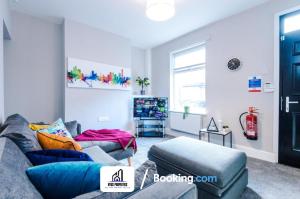 a living room with two couches and a window at Weekly Stay By NYOS PROPERTIES Short Lets & Serviced Accommodation Manchester With Free parking in Manchester