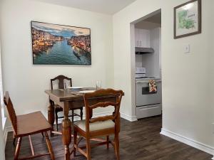 a dining room with a table and two chairs at Cabo San Roman entire Condo with patio 5 min from Casino in Lake Charles