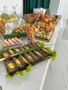 a buffet with many different types of food on a table at Casa DAIANA in Moisei