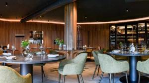 a dining room with two tables and chairs at Casa la meridiana in Laigueglia