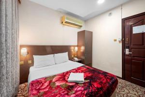 Postel nebo postele na pokoji v ubytování Najiba Hotel