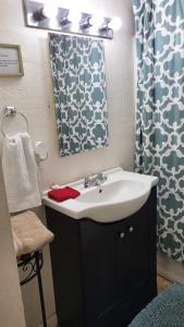 a bathroom with a sink and a mirror at U3 - Comfortable 1 BR & 1 BA APT in DT PHX with pkg in Phoenix