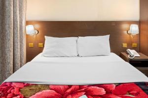 Postel nebo postele na pokoji v ubytování Najiba Hotel
