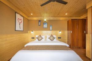 Voodi või voodid majutusasutuse The Countryside Retreat I Vacations I Conference I MICE I Family Events I Open Air Terrace I Sky Bonfire I Kufri by Exotic Stays toas