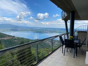 a balcony with a view of a lake at Dolcevista Apartment in Massino Visconti