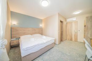 Posteľ alebo postele v izbe v ubytovaní Rabie Aparthotel