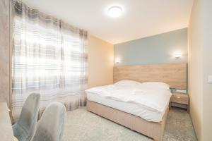Posteľ alebo postele v izbe v ubytovaní Rabie Aparthotel