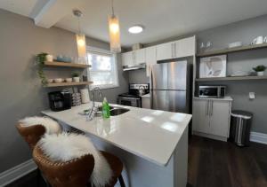 a kitchen with a white counter and a refrigerator at Rustic Elegance & Style 1BR in London +9 photos