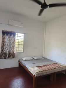 A bed or beds in a room at Chords of Nature Hostels & Hut Stays Pondicherry