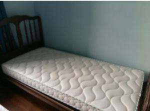 A bed or beds in a room at Gite de Chassigny