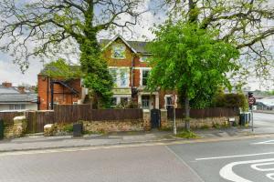a house on the corner of a street at Fairview Boutique Apartments in West Bridgford Centre in Nottingham +53 photos