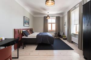 Postel nebo postele na pokoji v ubytování Centra Nams - Center Apartments