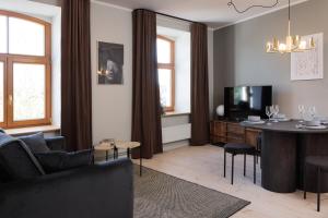 TV a/nebo společenská místnost v ubytování Centra Nams - Center Apartments