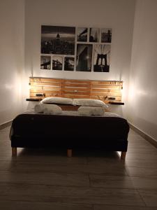 a bedroom with a bed in a room at LA CASA DEL RIONE SANITA’ in Naples