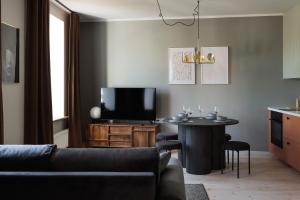 TV a/nebo společenská místnost v ubytování Centra Nams - Center Apartments + 32 fotografií