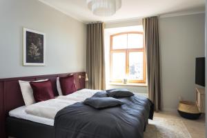 Postel nebo postele na pokoji v ubytování Centra Nams - Center Apartments