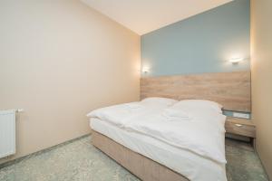Posteľ alebo postele v izbe v ubytovaní Rabie Aparthotel