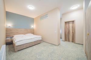 Posteľ alebo postele v izbe v ubytovaní Rabie Aparthotel