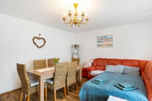 a living room with a couch and a table at Ferienwohnung Murgperle in Gernsbach
