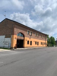 a large brick building on the side of a street at Locanda Bistrot Zia Nena 