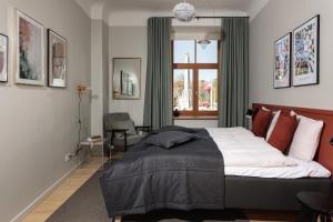 Postel nebo postele na pokoji v ubytování Centra Nams - Center Apartments