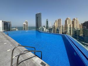 a large swimming pool on the roof of a building at Frank Porter - Marina Star in Dubai