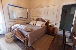 Postel nebo postele na pokoji v ubytování Villa Ghiringhelli