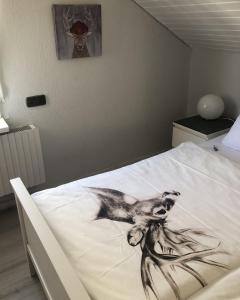 Säng eller sängar i ett rum på Ferienwohnungen Gabi Karnowski