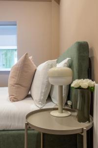 a room with a couch with pillows and a table at GuestReady - Dublin 8 Delight Retreat in Dublin