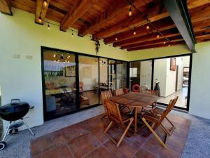 a dining room with a wooden table and chairs at Ideal home for your next get away in San Miguel de Allende