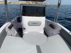 a boat with two seats in the front of the water at Bluline21 Open Speedboat Private Charters in Sliema